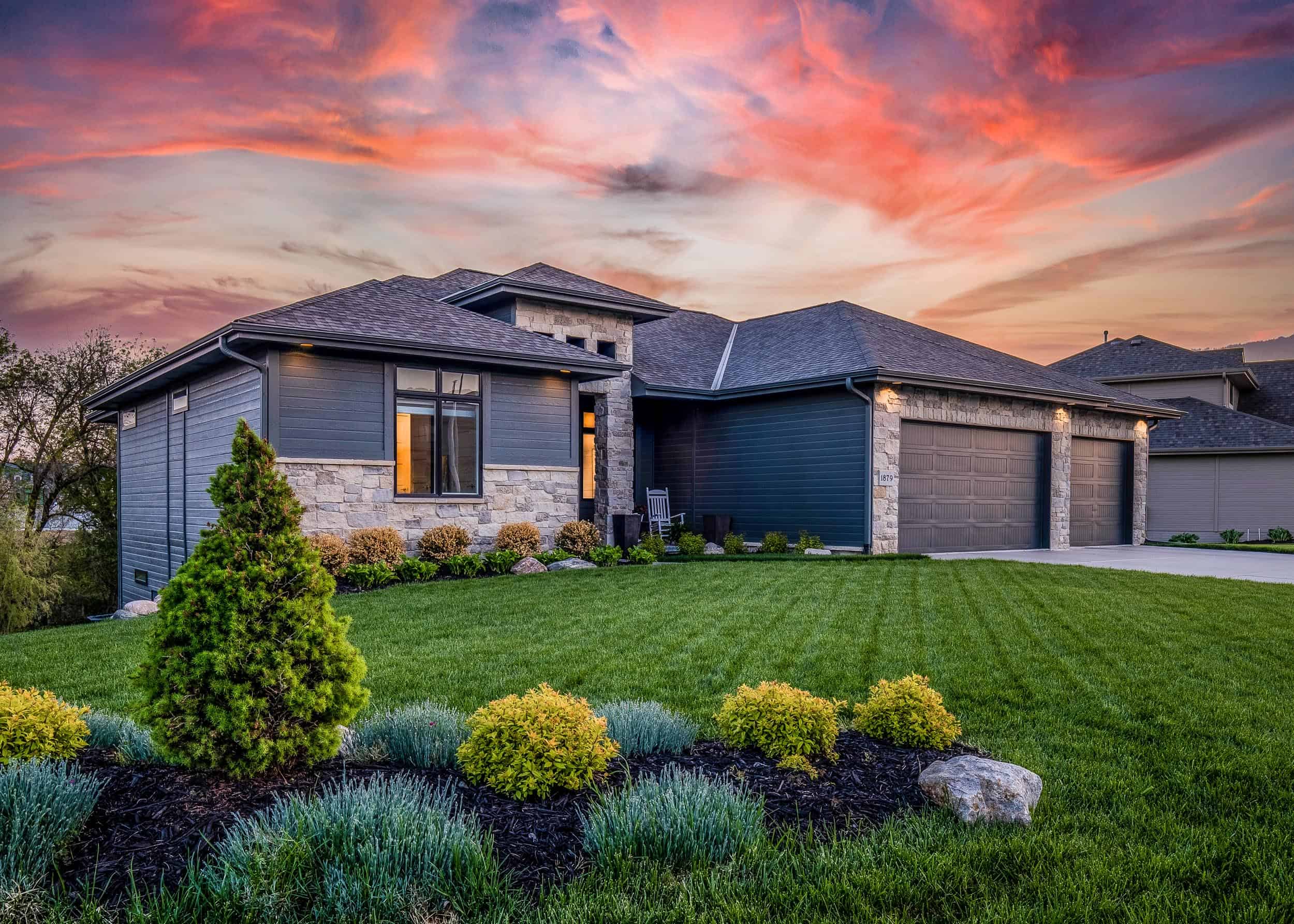 Luxury home during twilight golden hour with pink and purple sky